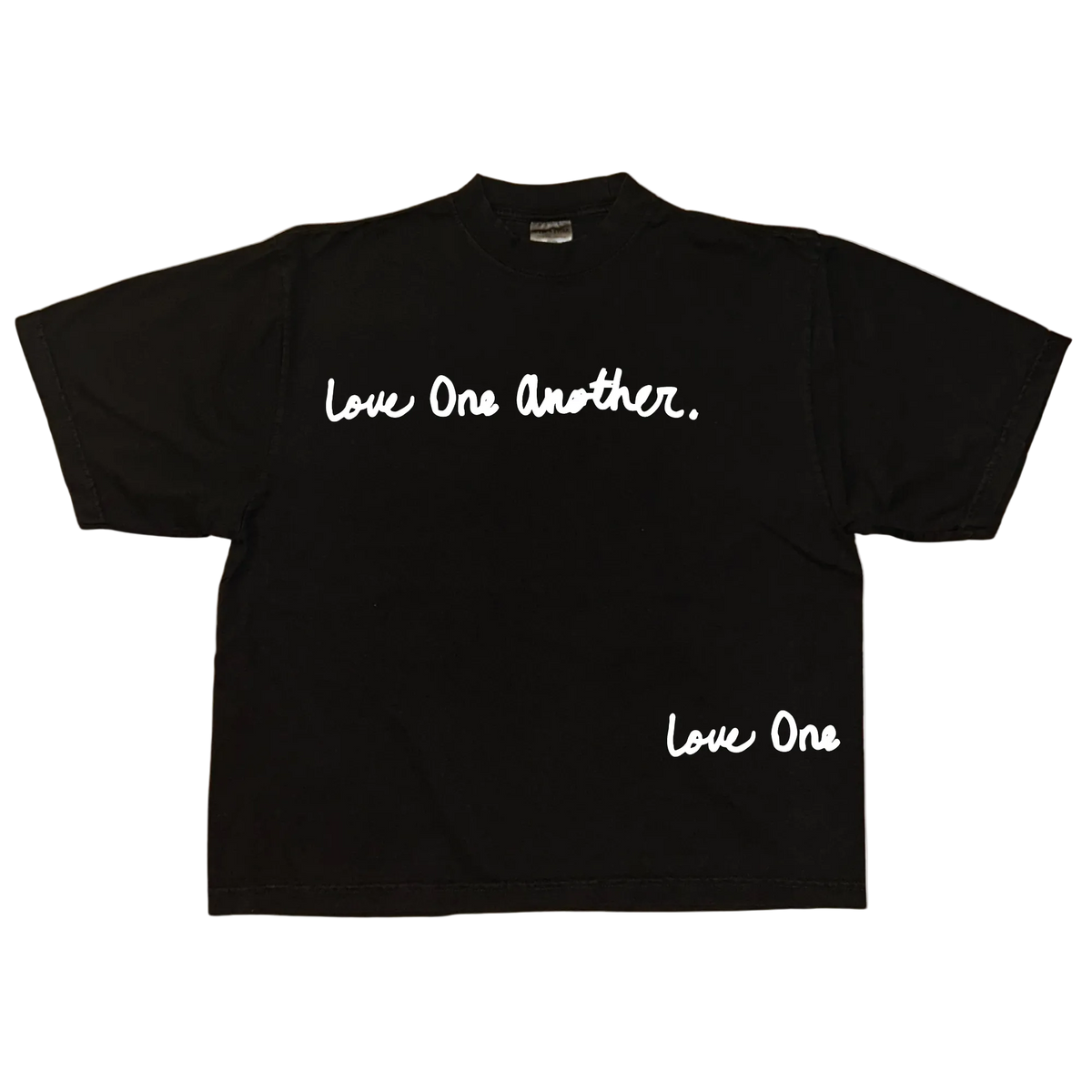 A black short-sleeve t-shirt with white script text reading 'Love One Another.' across the chest and 'Love One' near the lower right hem, displayed flat against a white background.
