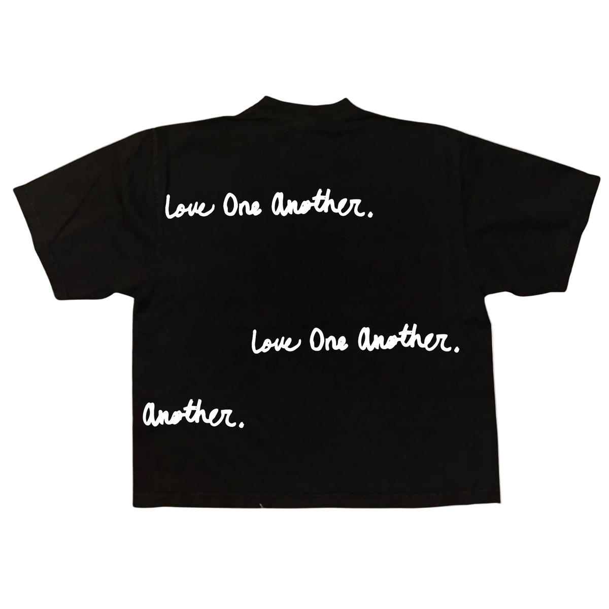 A black short-sleeve t-shirt shown from the back, featuring the phrase 'Love One Another.' printed in white script across the upper back, with additional text 'Love One Another.